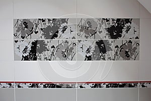 black and white gray tiles in the bathroom detail of flower