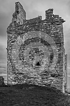 A Black and White High Contrast Image of The Crumbling Ancient Ruins of Greenan Castle looking over From Greenan Bay in Ayrshire