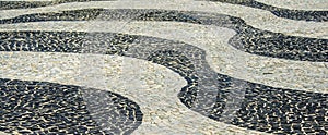 Black and white iconic mosaic by old design pattern at Copacabana Beach, Rio de Janeiro, Brazil
