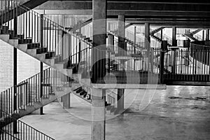 Black and white image with the architecture and various staircases and patterns inside a soccer stadium