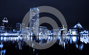 Black and white image of the Baltimore Inner Harbor Skyline at night. photo