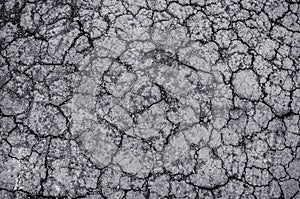 Black and white image of dry cracked soil texture background, dr