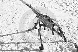 Black and white image of a large-caliber machine gun Utes on the firing position