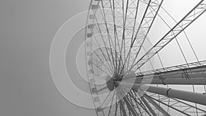 Black and white image of a large ferris wheel