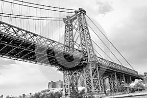 Black and White Image of Manhattan Skyline and Manhattan Bridge. Manhattan Bridge is a suspension bridge that crosses the East Riv