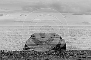 A black-and-white image of the old pier heading into the Atlantic ocean