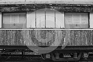 Black and White image of old used train bogey discharged in the park.
