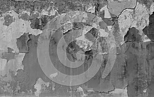 black and white image, old wall surface with peeling paint, plaster crack