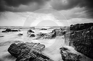 Black and white image,soft wave flow hitting the sandy beach