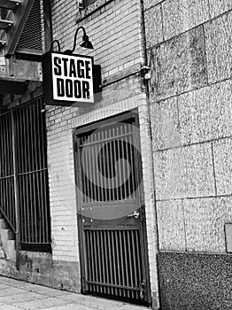 Black & White image stage door sign with lights