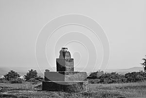 Black and white image of a stone structure in Goa