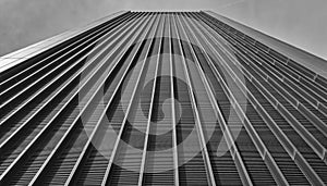 A black and white image of a tall futuristic london building