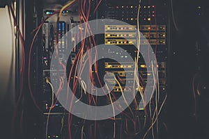 Black and white image of warehouse worker using barcode reader to scan packages on pallet