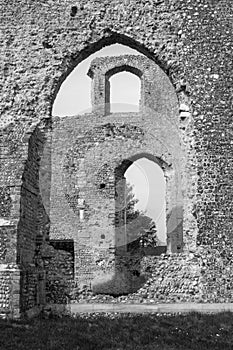 Black and white images of the ruins of the former St Andrew s Church, Walberswick, Suffolk, England, against a blue sky