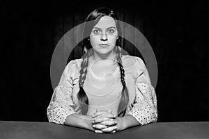 Black and White Intense Portrait of Pretty Young Woman with Braids