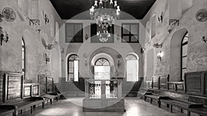Black and white interior of historic Jewish Maimonides Synagogue or Rav Moshe Synagogue with altar in front, Cairo Egypt photo