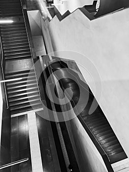 Abstract black and white interior staircases reveal urban architecture with dramatic geometric patterns