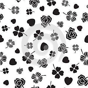 Black and white Irish symbols design with hand drawn shamrocks and hearts photo