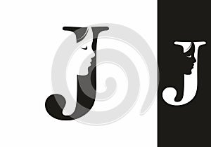 Black and white J initial letter with silhouette of women face