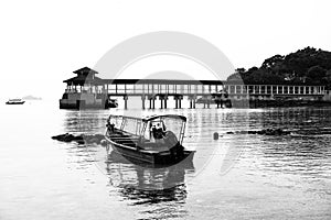 Black and white of jetty and fishing boats, Coral Bay, Perhentian Island Kecil, Malaysia