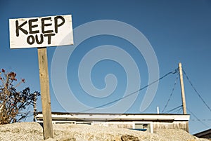 Black and white keep out sign
