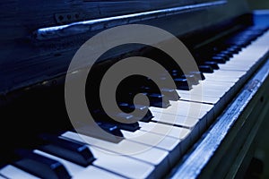 Black and white keys of an ancient piano keyboard