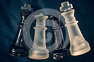 Black and white kings and queens in Chess