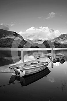 Black and white Landscape image of rowing boats on Llyn Nantlle