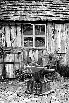 Black and white landscape of old blacksmiths workshop in Victorian times