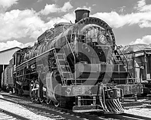 Black and white landscape with a old time worn locomotive