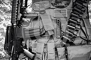 Black and white laying tactical equipment composition.