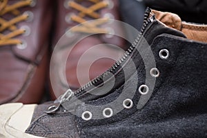 Black and white leather boot with zipper