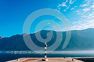 Black and white lighthouse in the sea. Prcanj, Kotor Bay, Monten