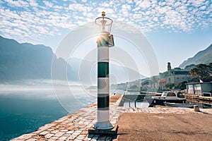 Black and white lighthouse in the sea. Prcanj, Kotor Bay, Monten