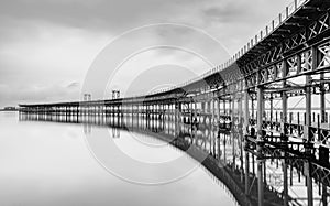 Black and white long exposure of the historic Rio Tinto pier in Huelva photo