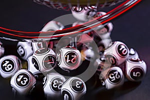 Black and white lottery balls in a machine 21