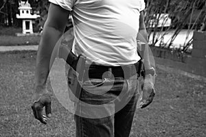 Black and white man and gun ready for shooting training to shooting practice at targets paper