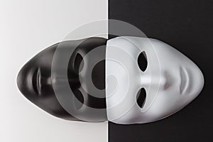 Black and white masks anonymity concept