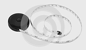 A black and white measuring tape for the waist measurement photo