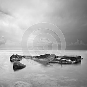 Black & White minimalist seascape with rocks.