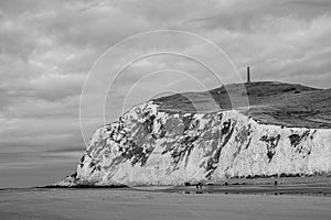 Black and white, or monochrome, seascape of the opal coast of Cap Blanc Nez, showing the Monument at Cape white Nose