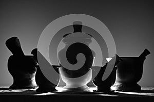 Black and white mortars and pestles photo