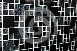 Black and white mosaic tiles wall texture. Abstract background and texture for design