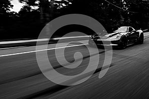 Black and White motion Blur Roller of American Muscle Car driving Fast