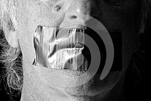 Black and white mouth duct taped shut photo