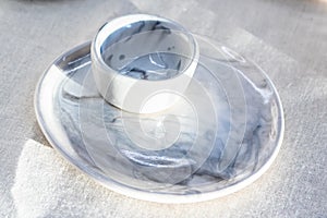 Black and white mug and saucer on the table