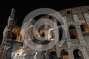 Black and white night view outside the Colosseum, Rome, Italy