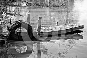 Black and white, Old, abandoned boat dock on a small lake