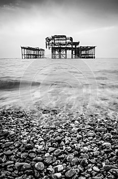 A black and white of the old burnt out pier in Brighton