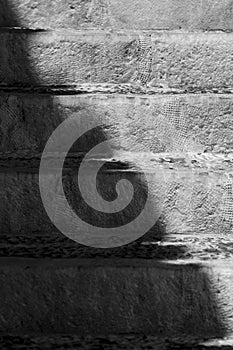 Black and white old stone stairs with shadow